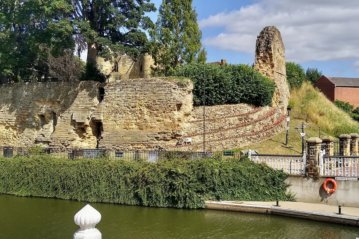Tonbridge Castle walls seen across the River Medway from River Walk